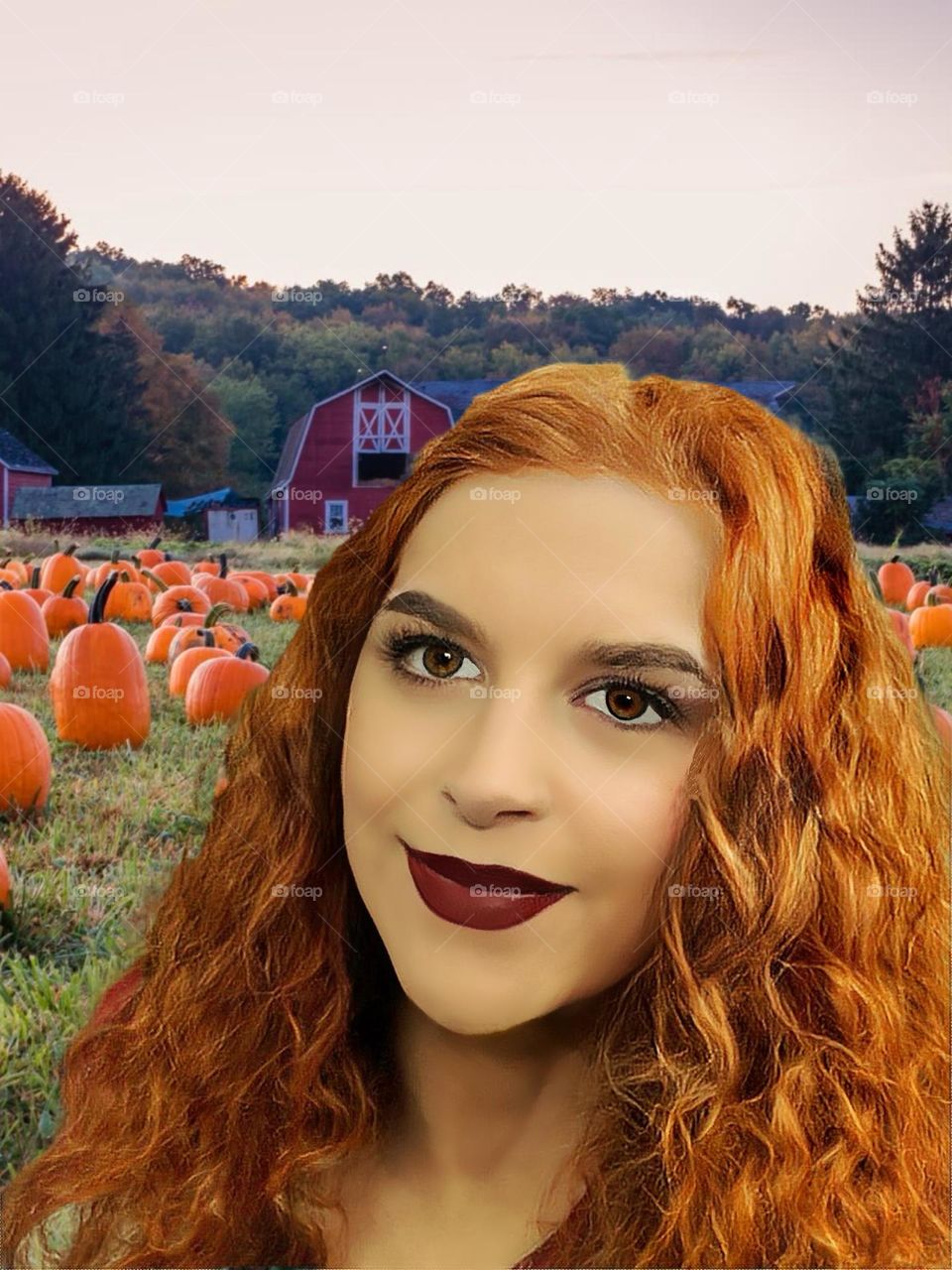 Pretty red headed  woman at the pumpkin patch.