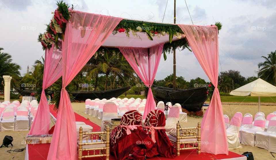 Wedding ceremony on the beach. Sunset time. Indian Ocean coast