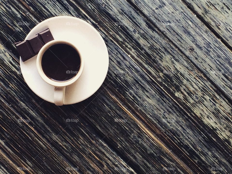 Espresso cup on wooden table