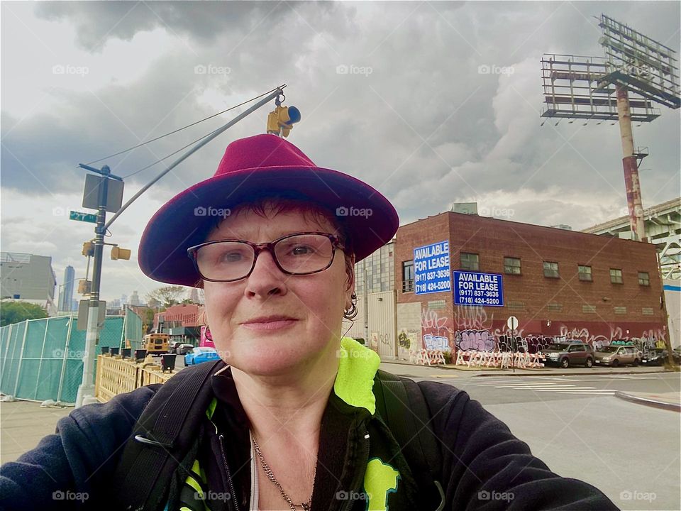 This is me, „Petra Schiller“ a.k.a. „Maxine Firefox“ a.k.a. „Maximiliane Feuerfuchs“ by the „Borden Avenue Bridge“ over „Dutch Kills“ in LIC, Queens on a grey overcast day in October 2023. Hypnotic Productions