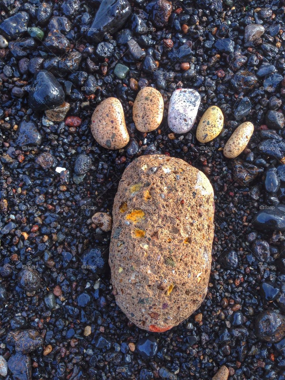 Leaving a footprint on a volcanic beach