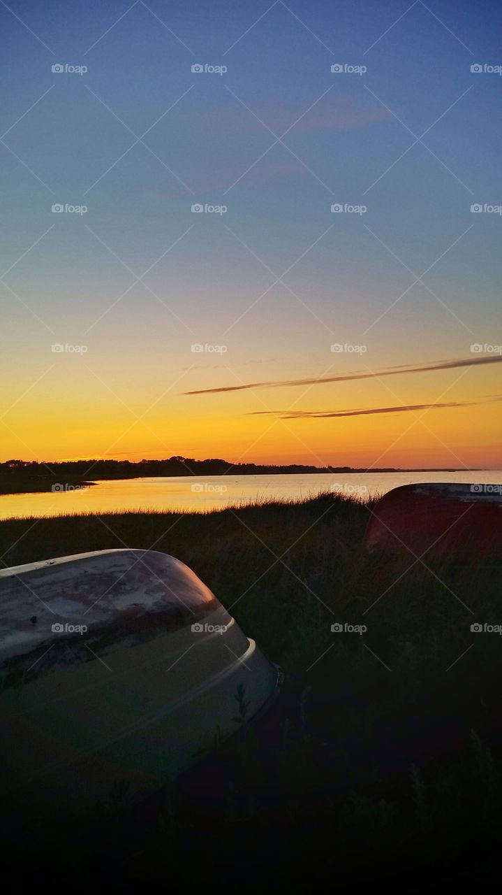 Boats in the sunset. . At Helberskov in North Jutland, Denmark 