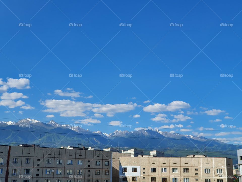 mountains behind the buildings