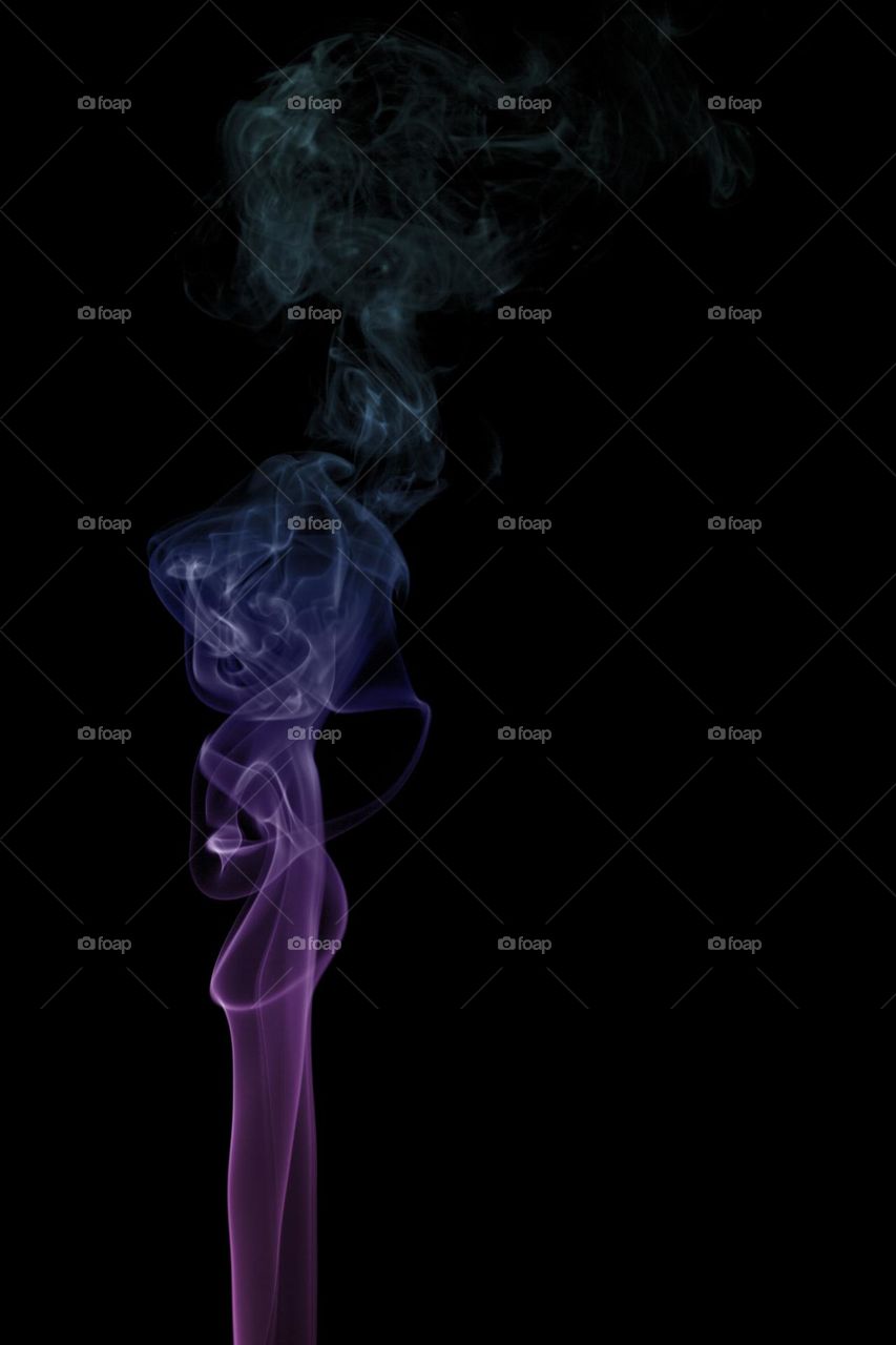 Abstract pink and cyan smoke on black background