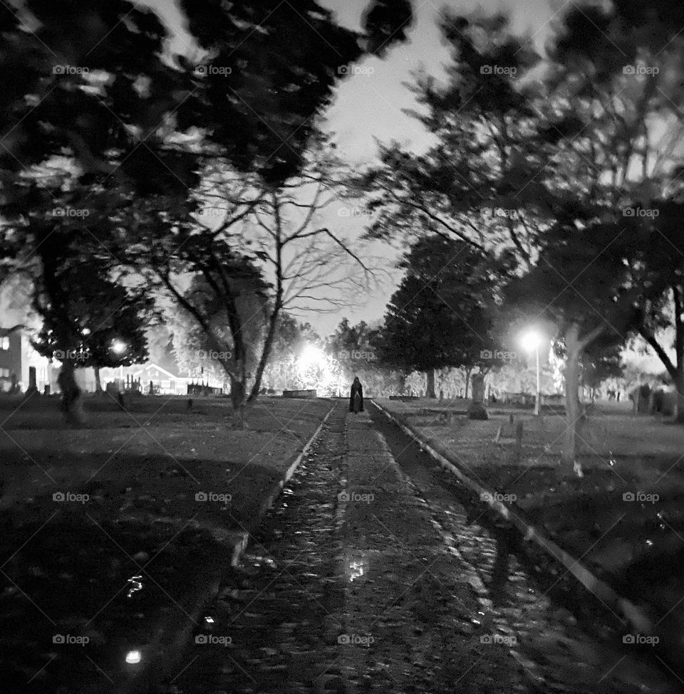 Cloaked figure in graveyard 