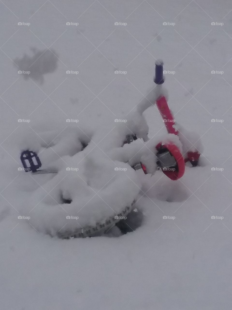 snow covered bicycle