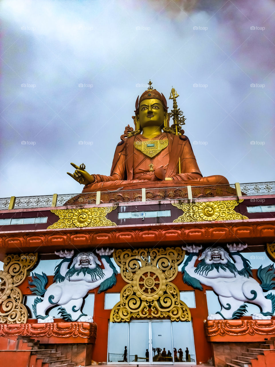 Samdruptse Hill; the 'wish fulfilling hill' is just 5 km away from Namchi, situated at an altitude of 2134 m (7000 ft). This epic hill is ornamented with a giant statue of the Guru Padmasambhava (Guru Rinpoche); the patron saint of Sikkim who has been showering its blessings since more than 1,200 years. It is a 45 m tall statue, overlooking the whole city, and is gilded with gold that glitters when the sunlight falls over it. The hill offers the vista of the magnificent Mt. Kangchenjunga amongst the richly forested hills under the blue painted sky. It is believed that the hill is a dormant volcano and only prayers can hold it from erupting, that is why the local monks offer their reverence and devotion to it
