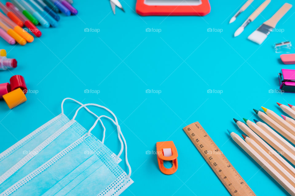 Set of school items on blue background. Back to school concept. Copy space