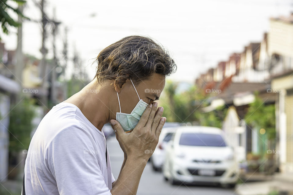 Asean man wear a mask to prevent dust in Bangkok ,Thailand