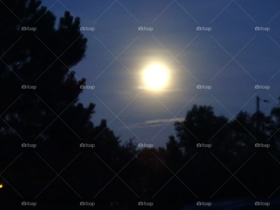 Moon on the rise. moon coming up in Lakewood
 Colorado