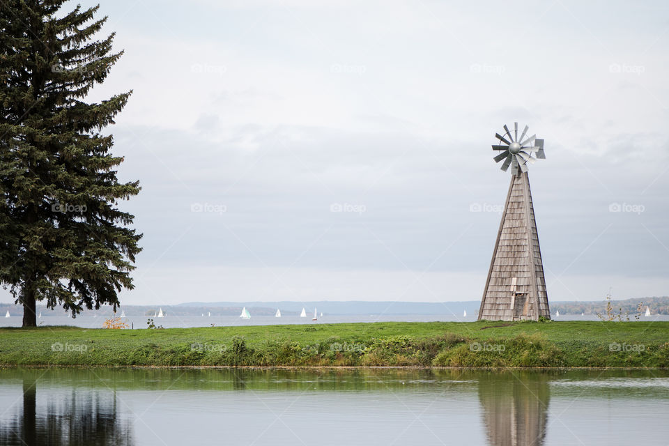 Reflection of the windmill in the pond