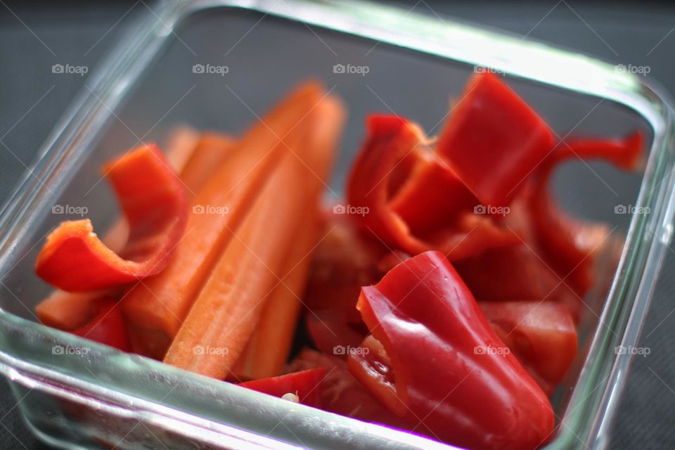 Sliced ​​red bell pepper in glass bowl