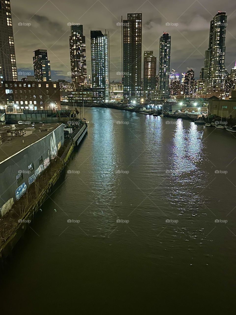 This is “Newtown Creek” seen from the “Pulaski Bridge” that connects “Greenpoint”, Bklyn and LIC, Queens presenting a fantastic all around view of NYC. On the left we see “Greenpoint”, Bklyn, then LIC and “Manhattan”. 2023. Hypnotic Productions