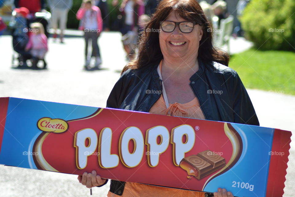 Woman holding chocolate bar box