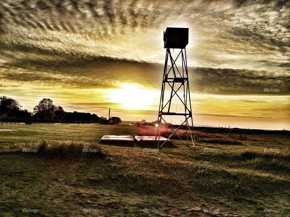 Lifeguard tower in sunset