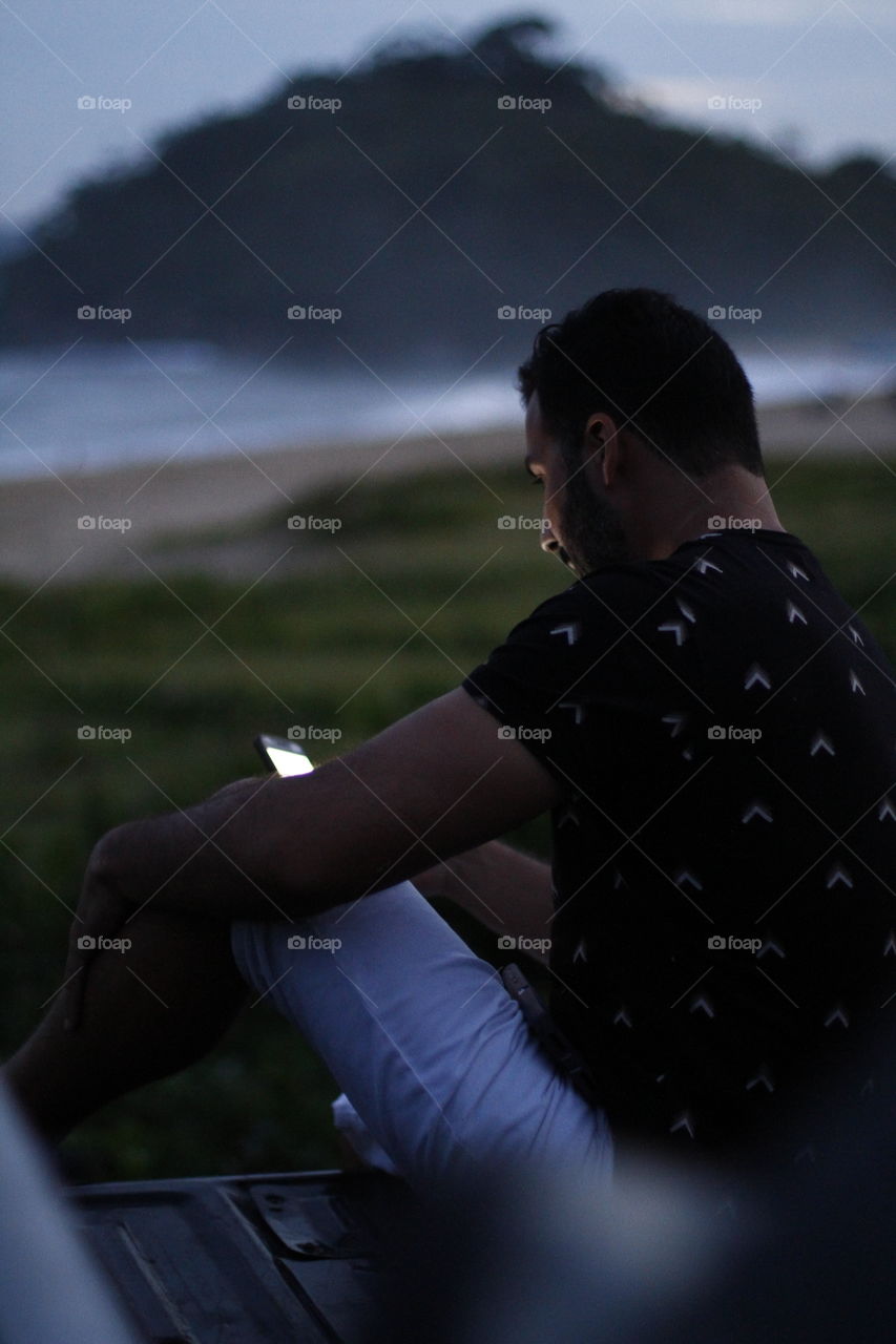 man sitting in his truck