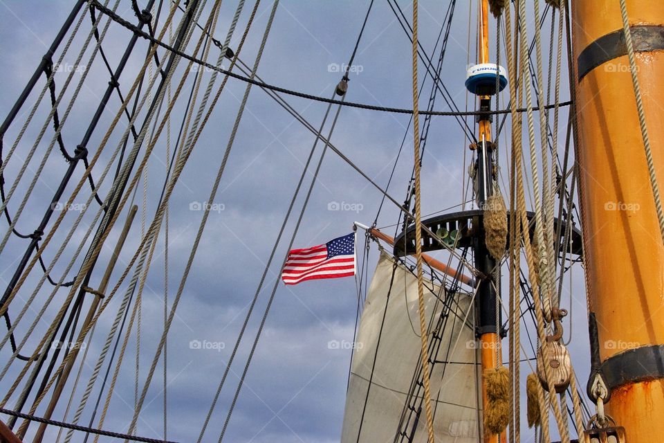 American flag flying from old schooner