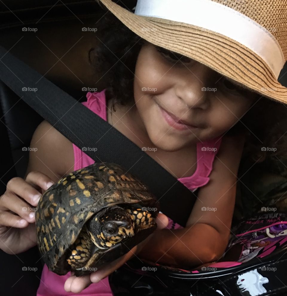 We help turtles crossing the street. She wanted to take a picture with it before setting it free. 