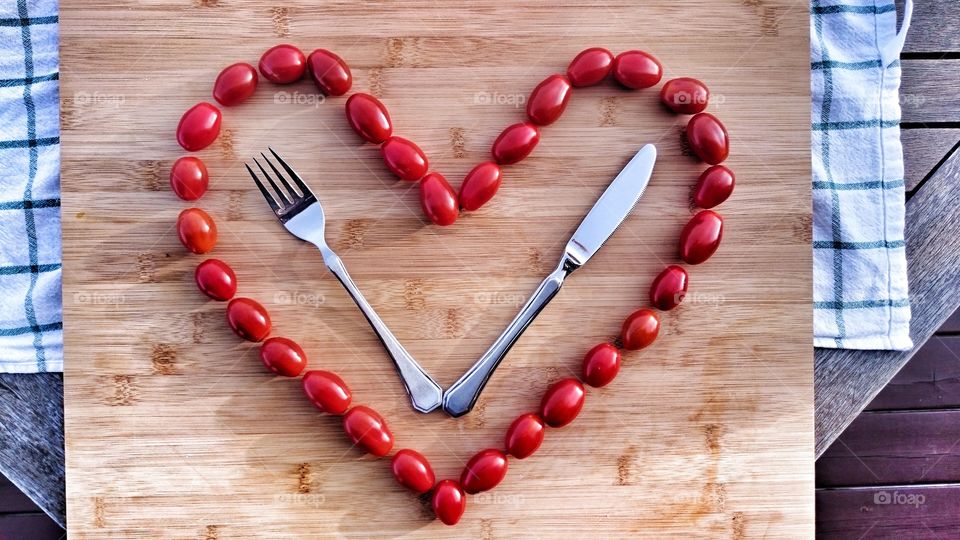 High angle view of heartshape tomatos on table