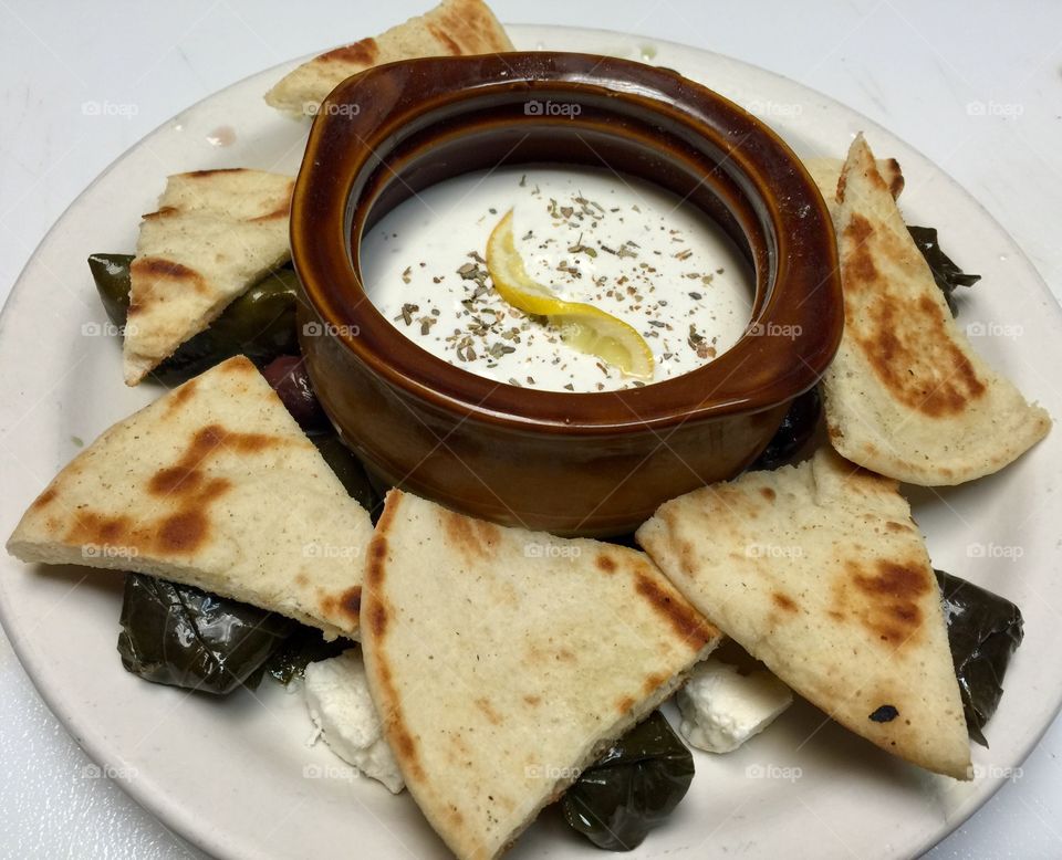 Tzatziki app with stuffed grape leaves 