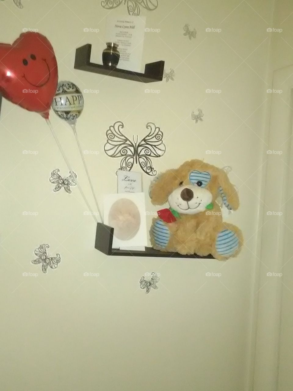 Memorial wall very beautiful teddy bear with balloon and their lovely daughter