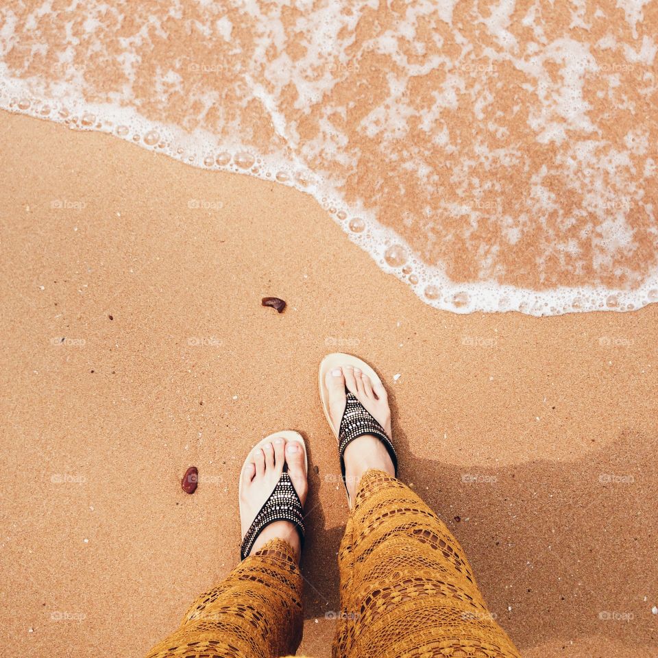 Low section of a woman on beach