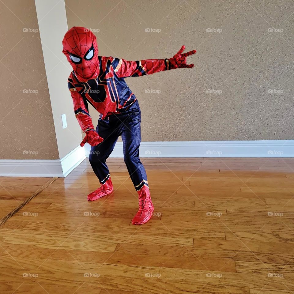 The boy is  dressed in his favorite character's clothes