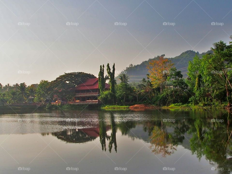 Scenic view of lakeside with reflection