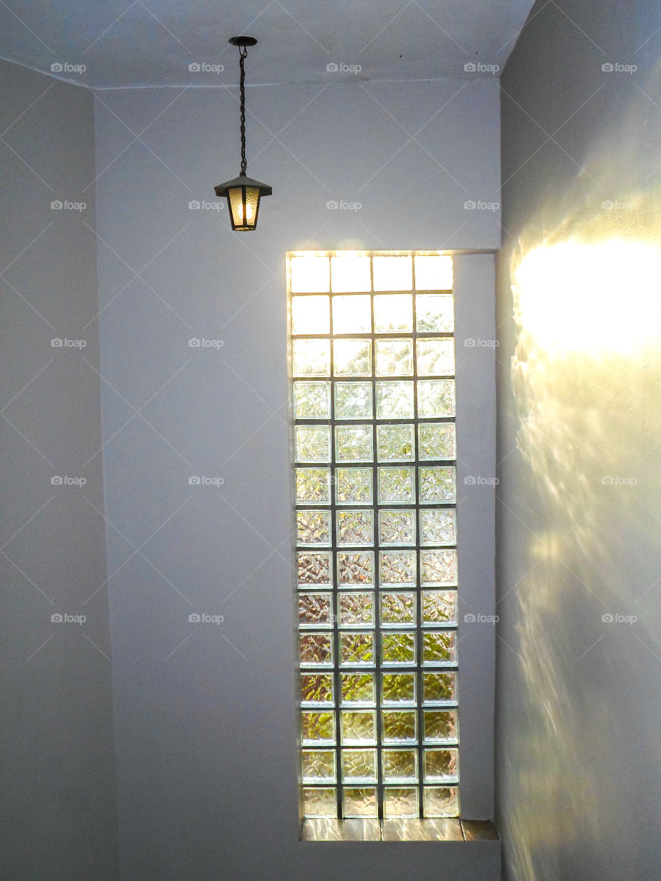 sun through window with a light on