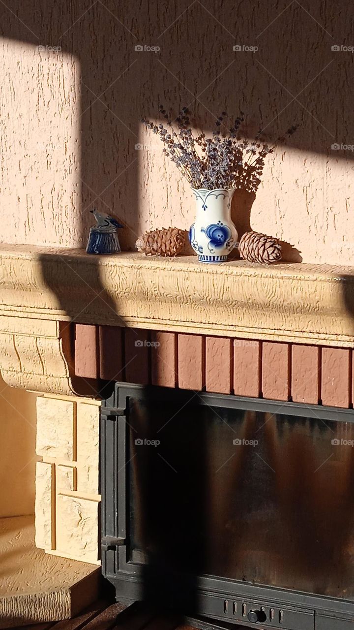 a mantelpiece illuminated by the sun