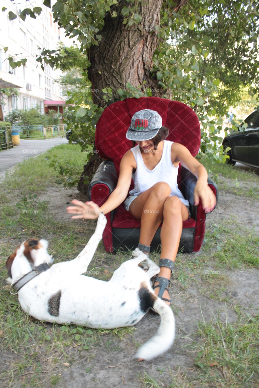 Dog playing with brunette girl 