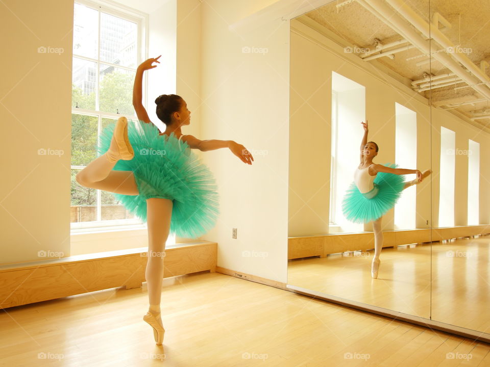 Blue tutu. Young ballerina practicing her craft. 