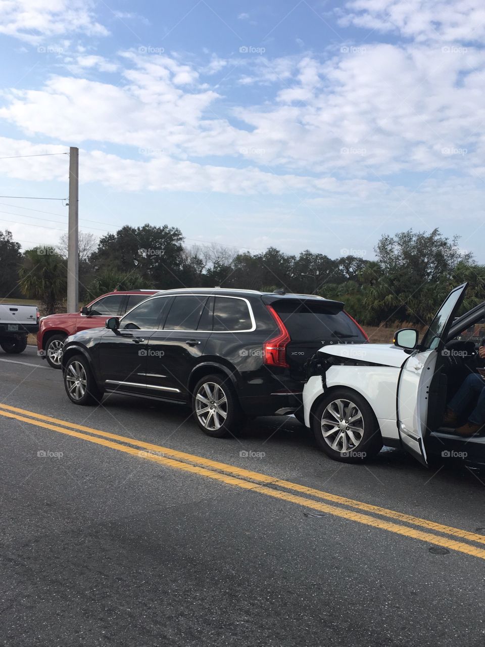 Car crash on the road Volvo XC90 and Land Rover 