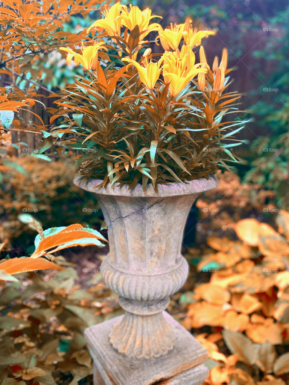 Lilies in pot, cast in orange, yellow, and turquoise 