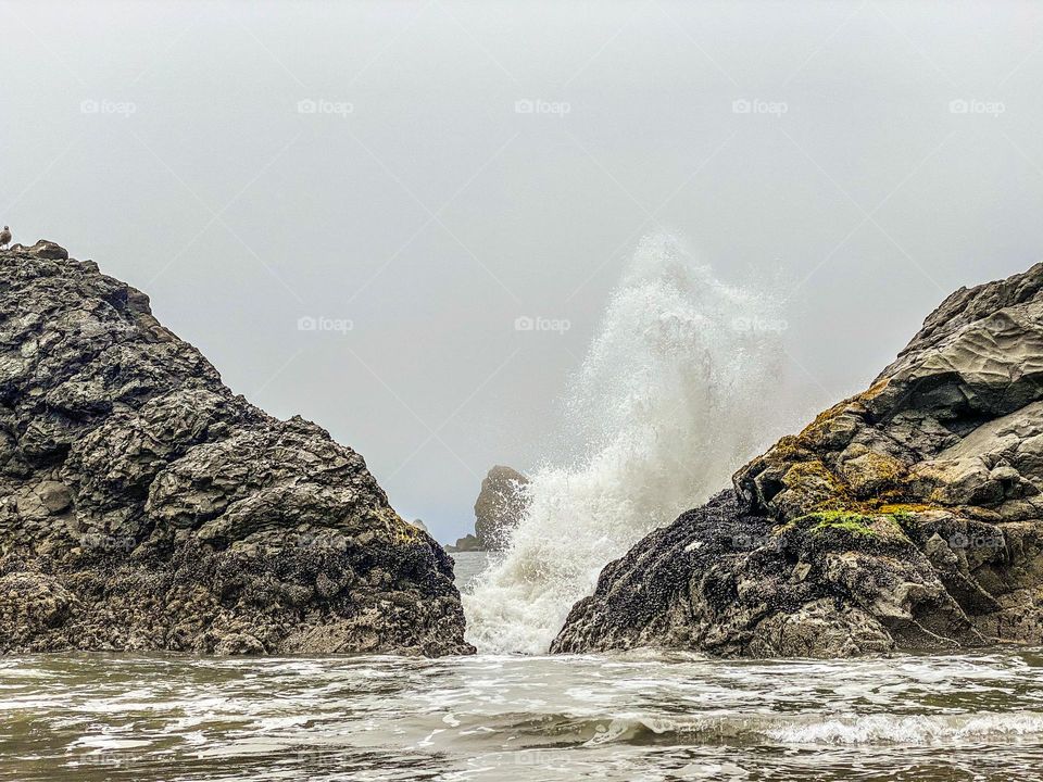 Waves crashing against rocks along the Oregon coast 