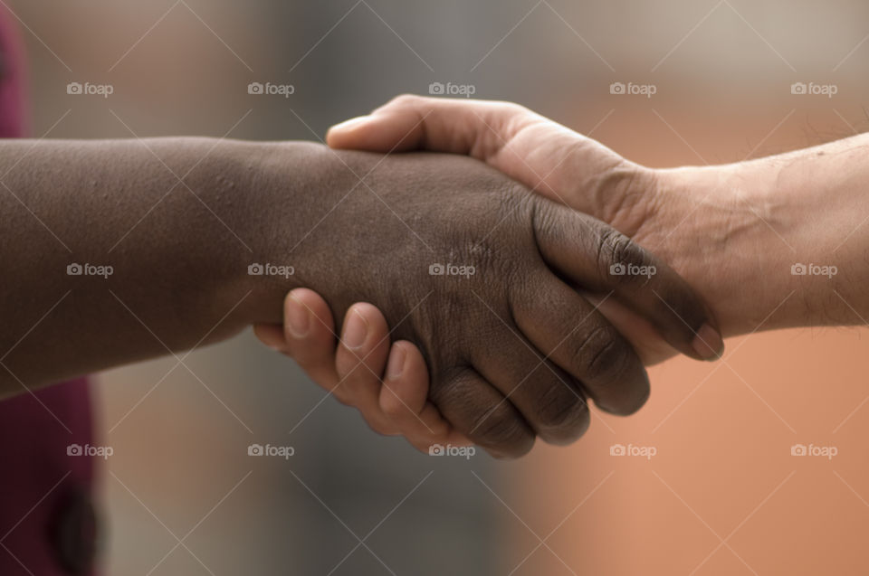 Handshake in blurred background