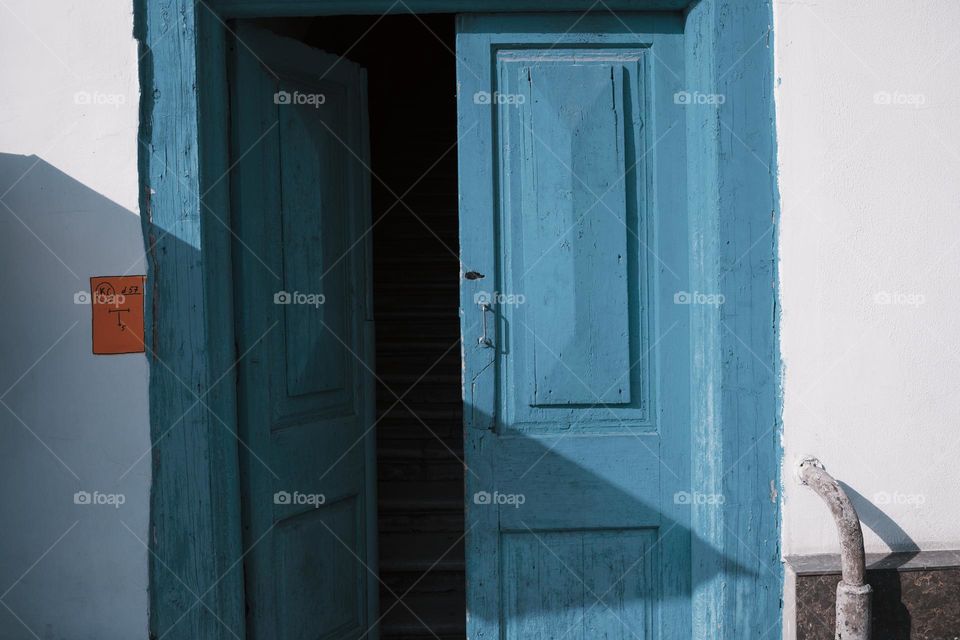 Open blue wooden door