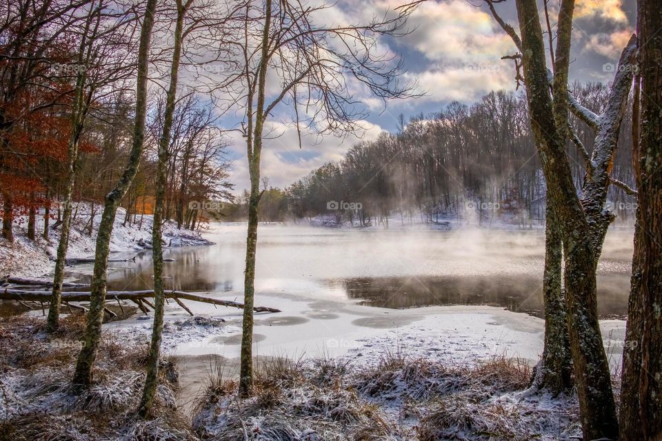 All three forms or phases of water in one frame, and each in white: solid (ice & snow), liquid (lake water), and vapor (mist & clouds). Grundy Lakes Park, Tracy City, Tennessee. 