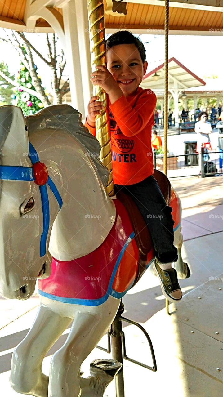 Boy on merry-go-round 