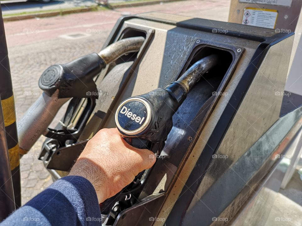 Man refueling at a gas station