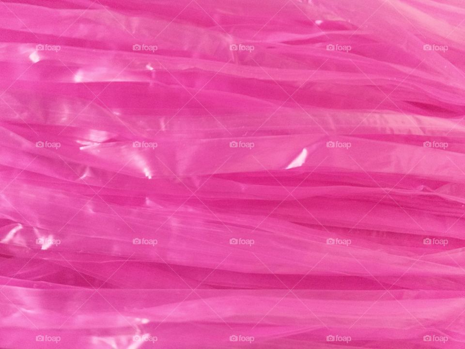 Abstract background of pink plastic rough surface