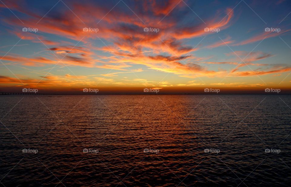 Dramatic sky reflecting in sea