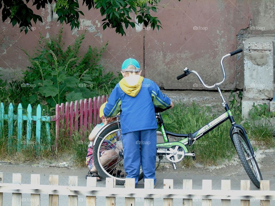 boys and bike