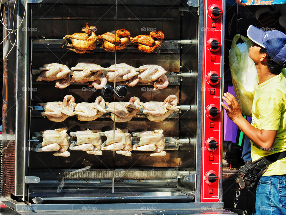 Chickens roasting on the street in Phnom Penh 