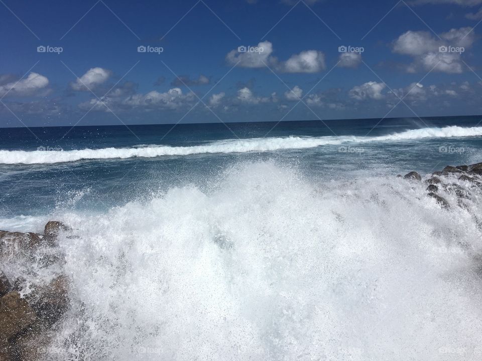 Wave splashes on the reef. Fuah Mulah