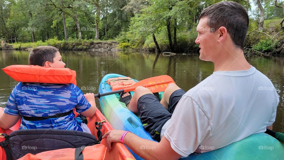 father and son going kayaking in Florida