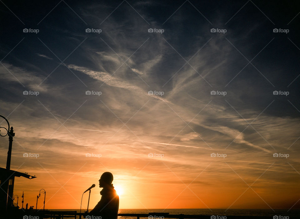 Singer Silhouette at Sunset