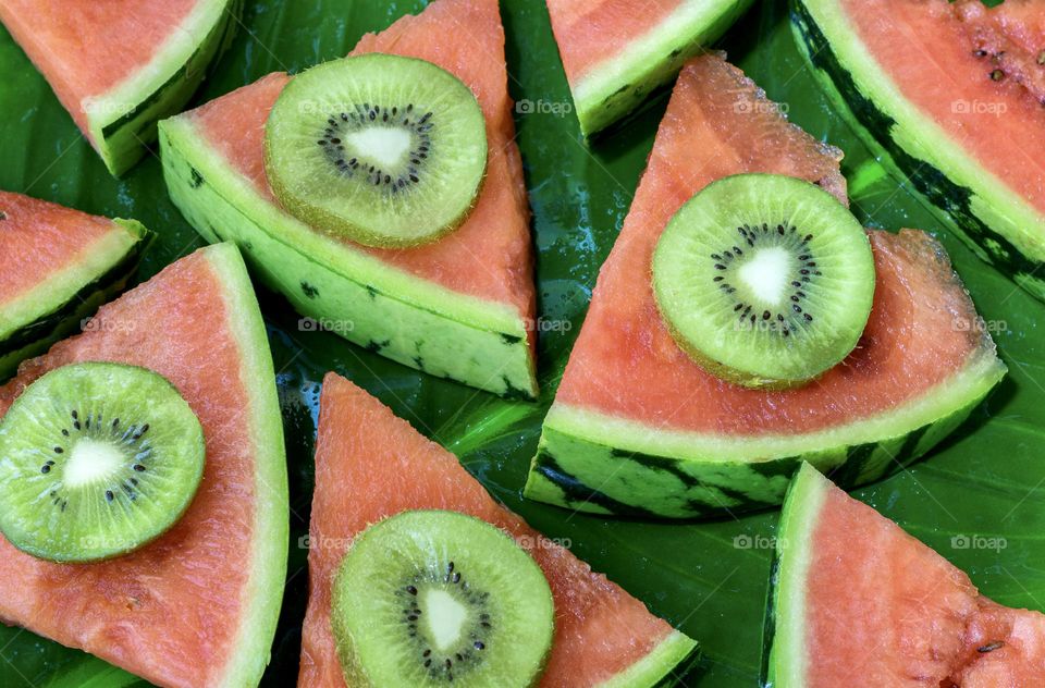 Triangles of water melon topped with kiwi