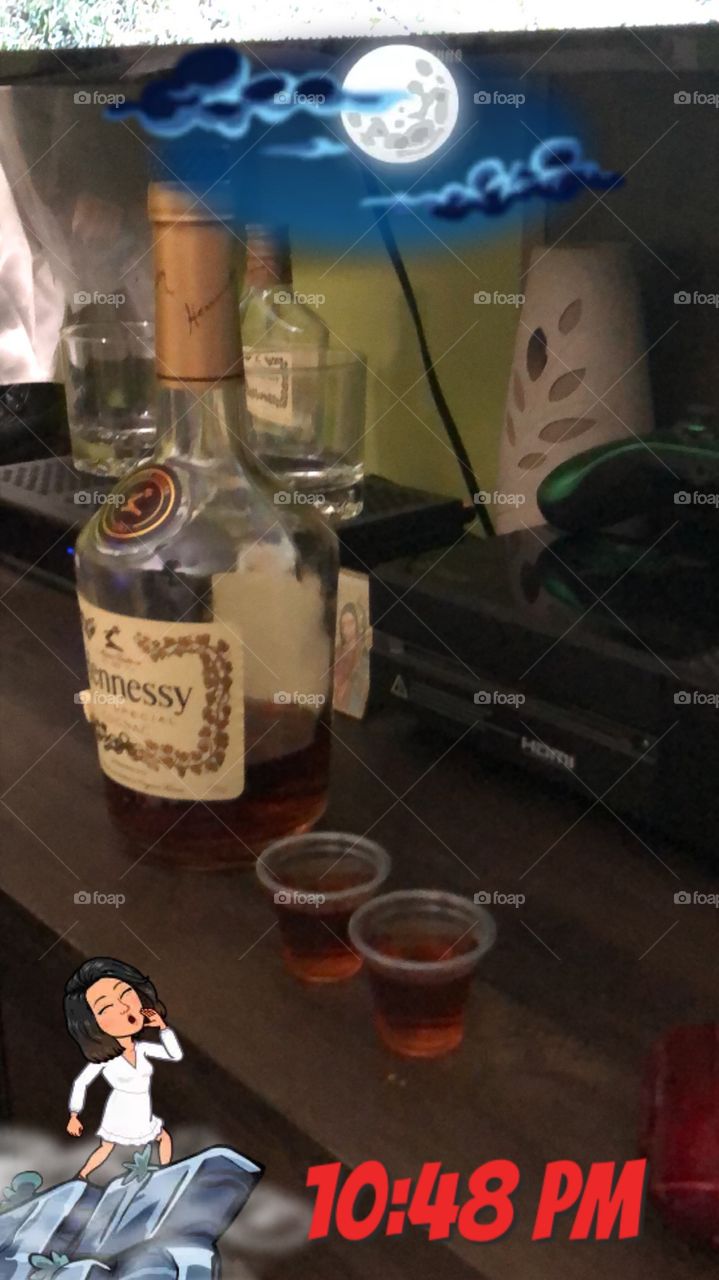 Having a night cap with  a  friend in his man cave . He  always has the Good stuff, Hennessy ain’t no ok 