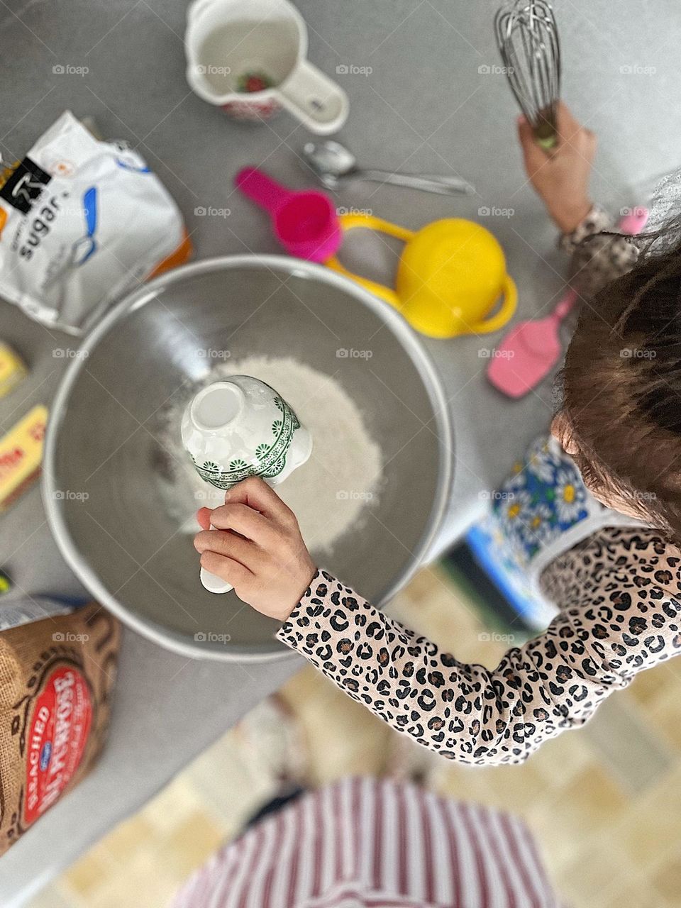 Helping mommy bake, toddler helps mother measure ingredients, baking with mommy, mommy and me time, making homemade cookies, baking delicious homemade cookies 